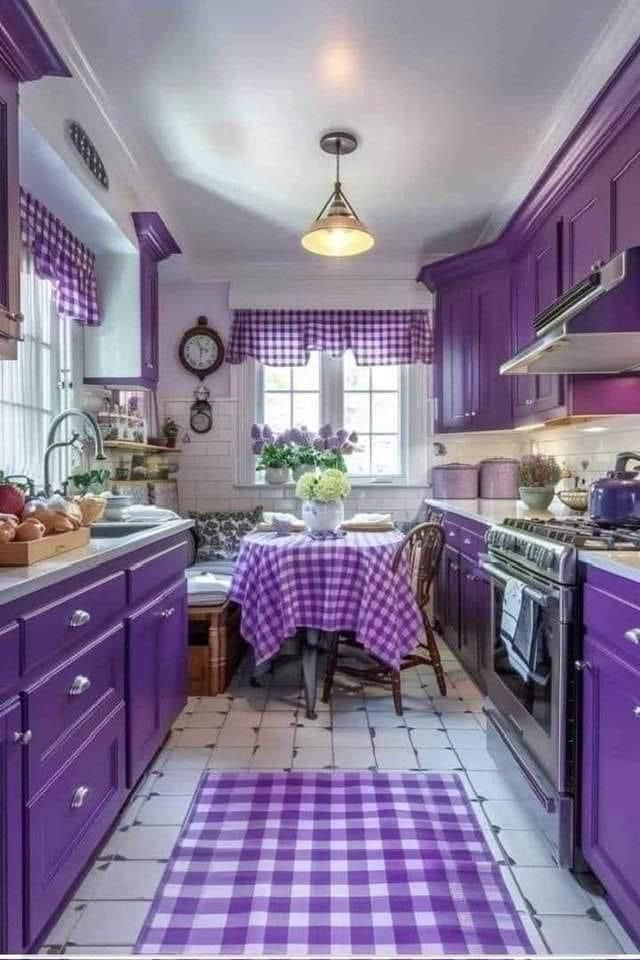 a kitchen with purple cabinets and checkered table cloth