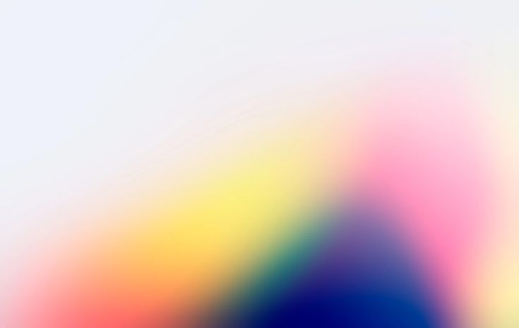 an abstract blurry background with blue, yellow and pink colors