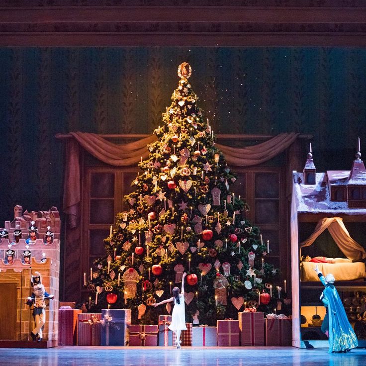 there is a christmas tree in the middle of this stage