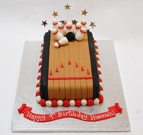 a birthday cake with bowling pins on it