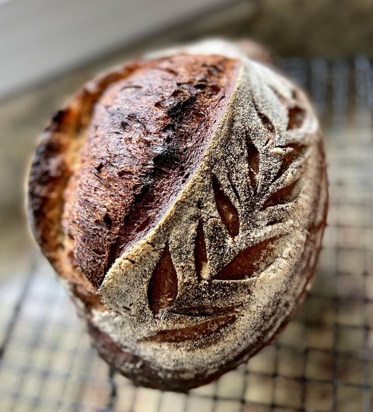 a loaf of bread sitting on top of a cooling rack