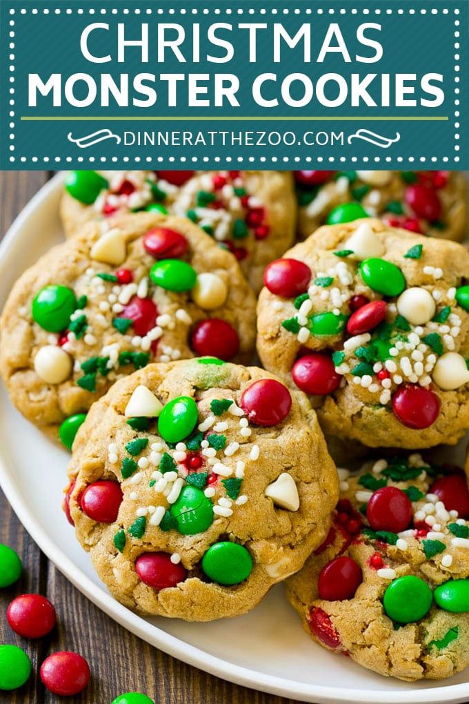 christmas monster cookies on a white plate with green and red candies