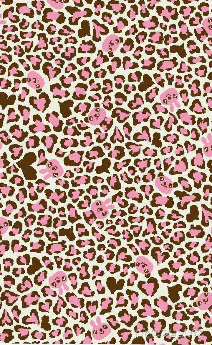 a pink and brown leopard print fabric with hearts on it's back end,