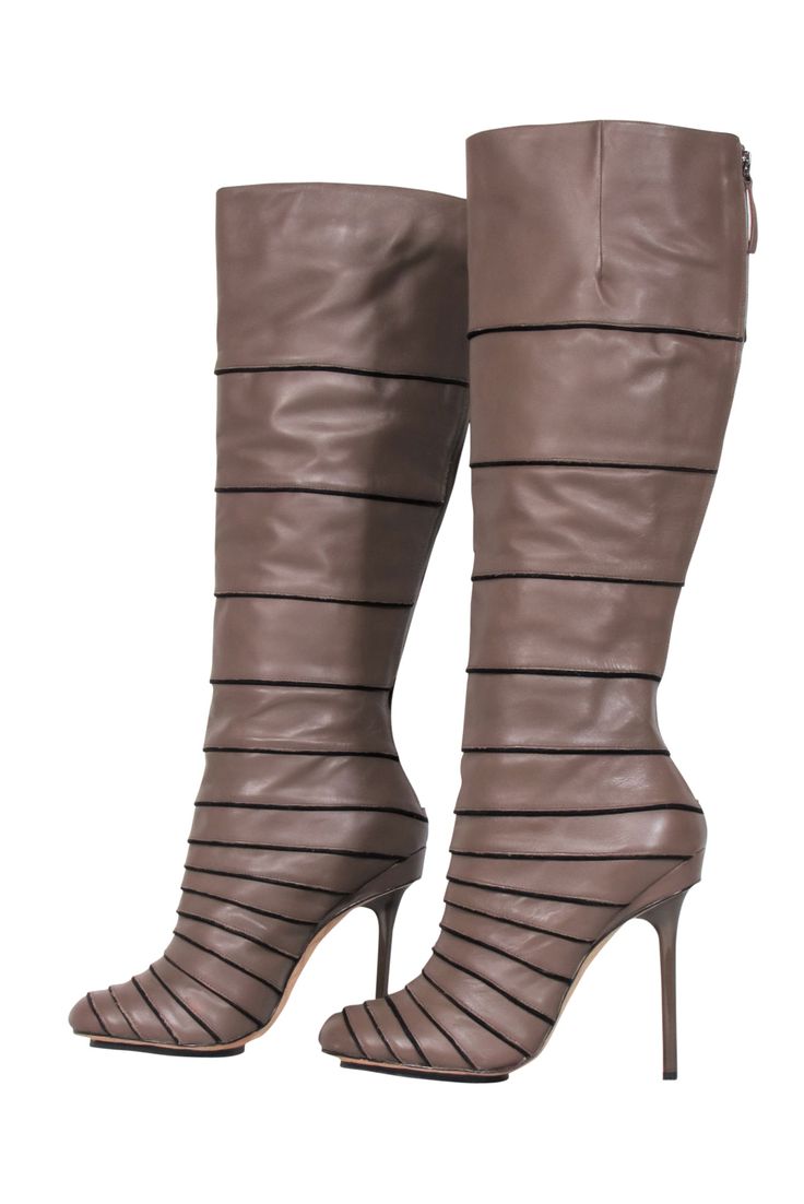 Get a head start on winter by snatching up these gorgeous boots from L.A.M.B. Made in a light brown hue, the leather is designed with a wrapped look and a striking stiletto heel. Pair with skinny jeans for a casual autumn ensemble or dress the shoes up with a chunky knit sweater dress. Size 9.5 Leather upper zipper closure at back Heel Height 4.5" Shaft length 16" Shaft circumference 15.25" Beige Leather Knee-high Winter Boots, Fitted Brown Calf Leather Boots, Winter Beige Calf Leather Boots, Brown Knee-high Boots With Leather Lining For Winter, Brown Leather Lined Knee-high Boots For Winter, Brown Leather Sole Knee-high Winter Boots, Brown Leather-lined Knee-high Boots For Winter, Brown Calf Leather Knee-high Boots For Winter, Party Brown Boots With Leather Lining