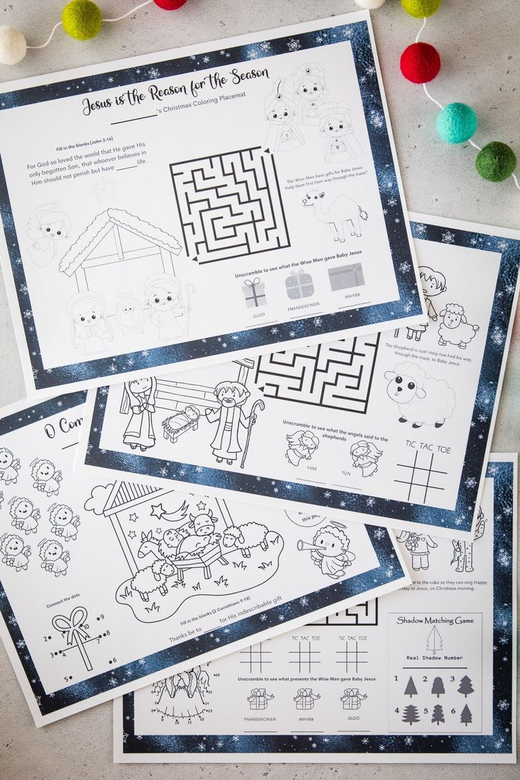 four christmas worksheets are shown on the table