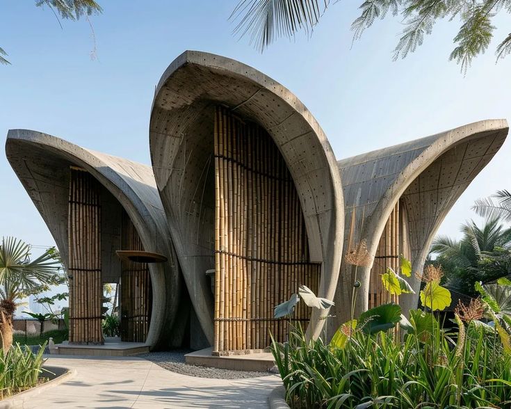 an artisticly designed building in the middle of palm trees