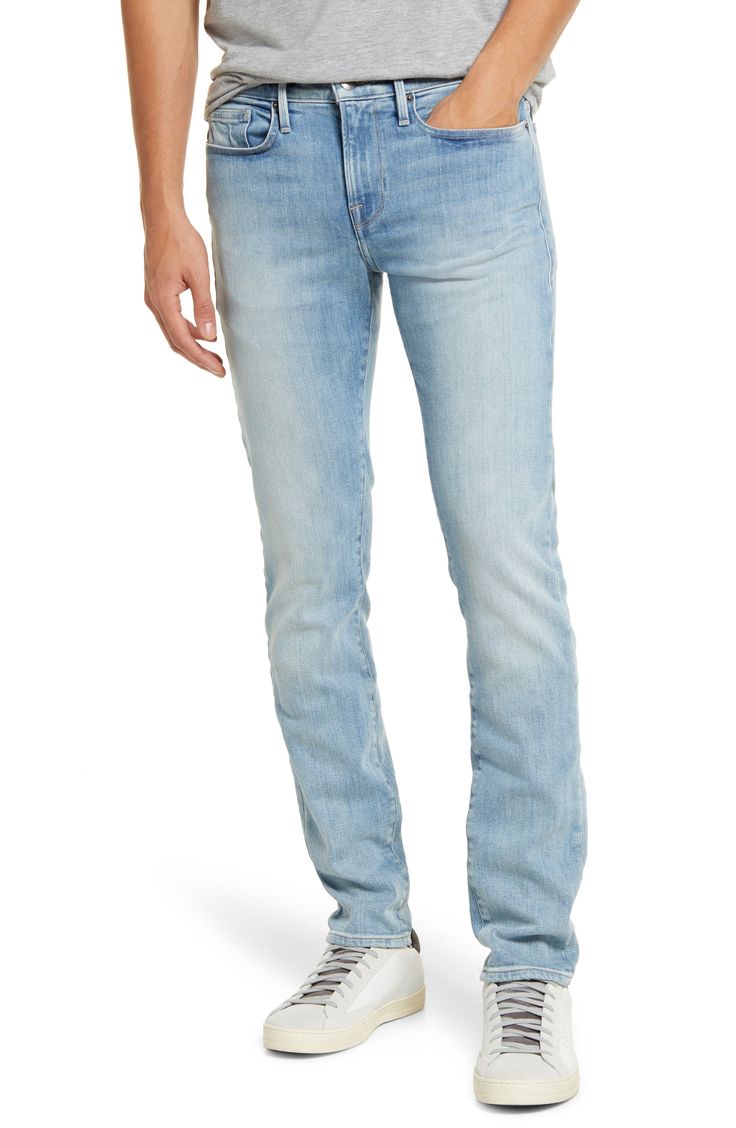 Faded and whiskered stretch denim gives a broken-in finish to casual-cool jeans cut slim through the hips for a modern profile. 32" inseam; 12" leg opening; 9" front rise; 13 1/2" back rise (size 29) Zip fly with button closure Five-pocket style 96% cotton, 3% elasterell-p, 1% elastane. Machine wash, tumble dry Imported Men's Clothing Fitted Flare Jeans In Faded Rigid Denim, Fitted Light Wash Jeans With Frayed Hem, Modern Light Wash Straight Leg Jeans, Light Wash Straight Fit Bottoms With Standard Cut Leg, Slim Fit Medium Wash Jeans, Light Wash Stretch Straight Leg Jeans, Medium Wash Slim Fit Jeans, Light Wash Stretch Jeans With Straight Leg, Light Wash Fitted Straight Jeans