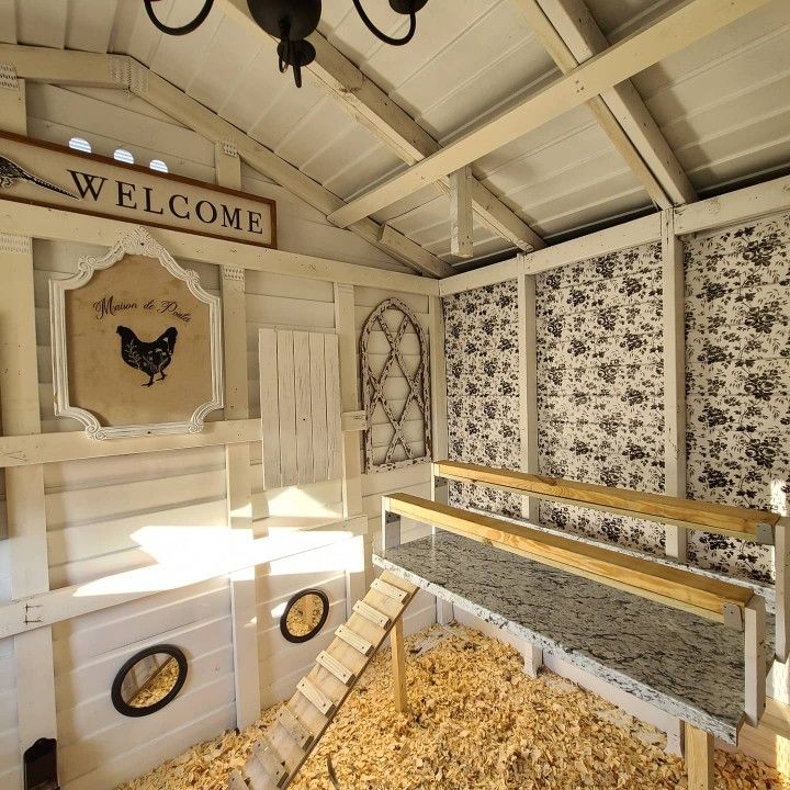 the inside of a chicken coop that has been made into a house with chickens in it