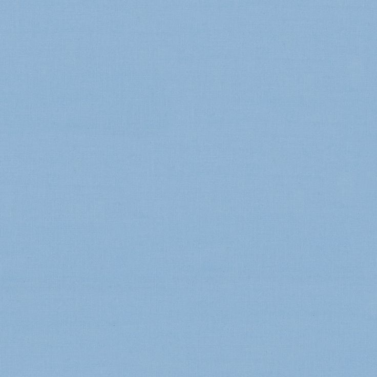 an airplane is flying in the sky on a clear day with blue skies behind it