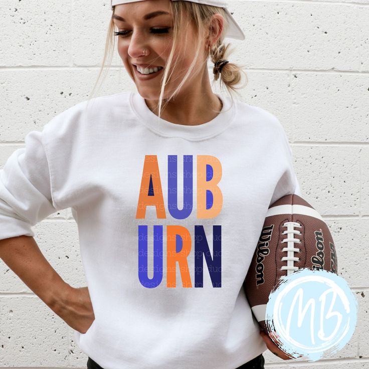 Get ready to show off your Auburn pride with this sweatshirt! With bold block letters and a game day ready design, this women's sweatshirt will elevate your school spirit. Perfect for football season or any day, this sweatshirt is a must-have for any Auburn fan! Tees run true to size. If you have any questions please feel free to ask. Fabric & Care:Machine wash warm or cold with mild detergentDry on normal dryer settingsDo not dry cleanDo not iron over design. If ironing is needed iron on low he Fall Varsity Sweatshirt With Team Logo, Collegiate Style Sweatshirt For Sports Events, Collegiate Team-colored Sweatshirt For Fall, Collegiate Sweatshirt For Football Season, Collegiate Sweatshirt For College Football Season, Collegiate Sweatshirt For Game Day, Collegiate Football Season Sweatshirt With Team Name, Collegiate Football Season Sweatshirt, White School Spirit Sweatshirt With Team Logo