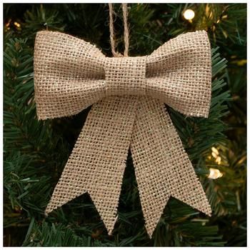 a christmas ornament with a bow hanging from it's side on a tree