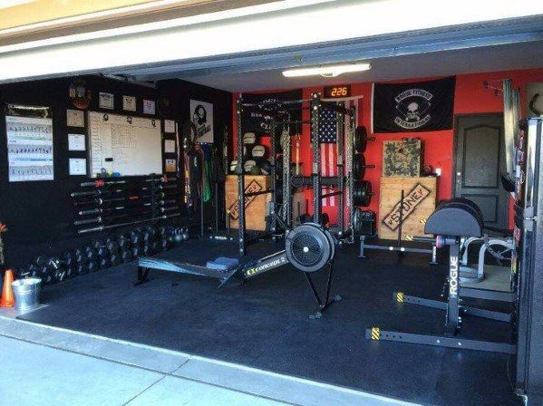 the inside of a home gym with equipment