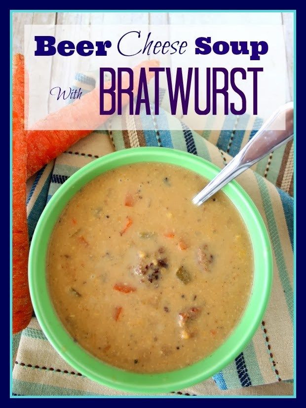 a bowl of beer cheese soup with carrots