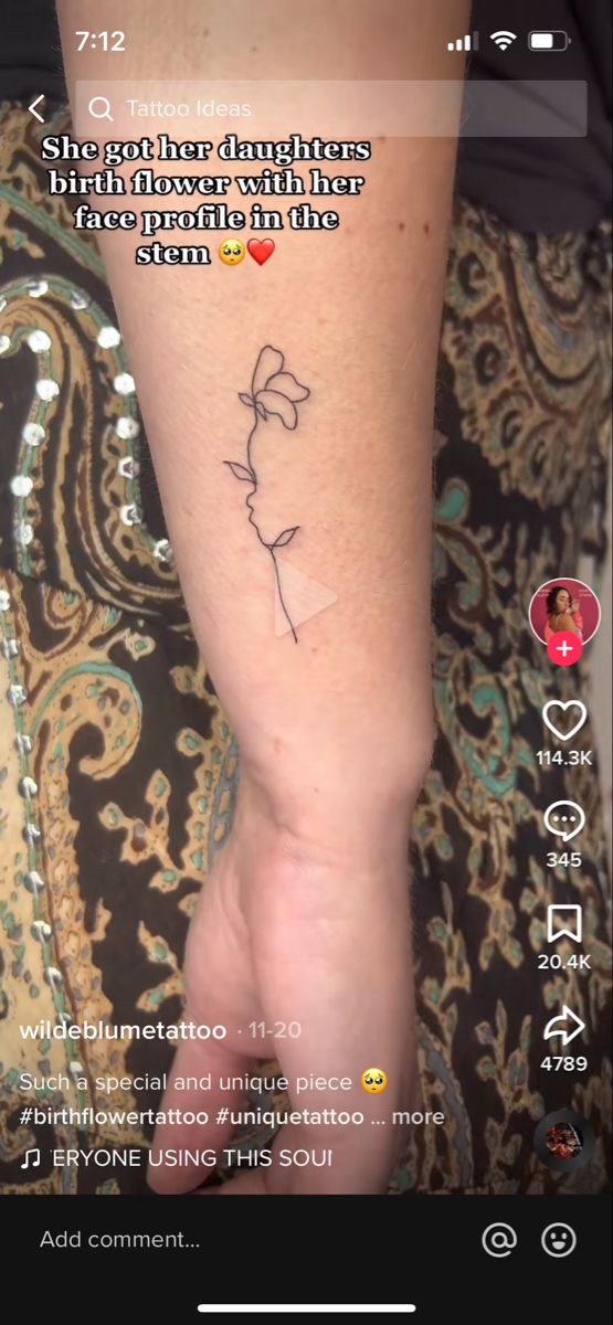 a person with a small tattoo on their arm