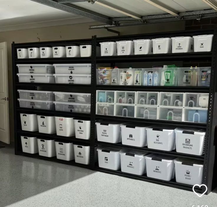 the shelves are filled with plastic bins and other storage containers for various items,