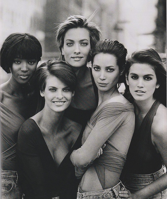 black and white photograph of six women posing together