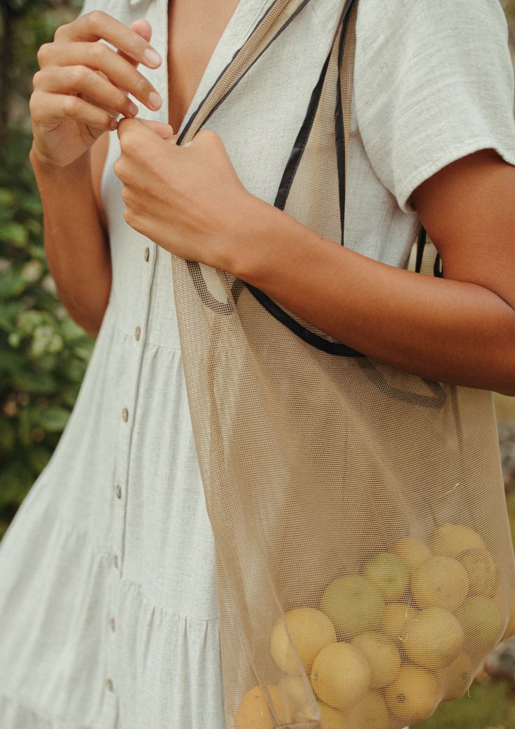 The NAT + Noor Joan Bag is the the perfect go-to bag for any adventure. This bag is made from a strong durable nylon that can hold 40lb. We have some ideas of where you might need this, use it as your reusable grocery bag, beach bag, book bag, pool bag, or that bag you always keep in your car to pull out. With all those adventures you might need to spray it down every once in awhile, but the good news it will be as good as new! Dimensions W: 20 H: 13.5 Holds 40 lbs Washing machine friendly, be s Practical Reusable Bags For Outdoor Activities, Recyclable Tote Bag For Outdoor Activities, Summer Tote Bags For Outdoor Activities, Summer Reusable Bag For Everyday Use, Summer Outdoor Tote Bag, Summer Reusable Everyday Bags, Summer Reusable Bags For Everyday Use, Reusable Summer Bags For Everyday Use, Natural Reusable Travel Bag