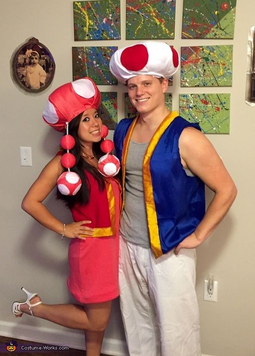 a man and woman dressed up in costumes