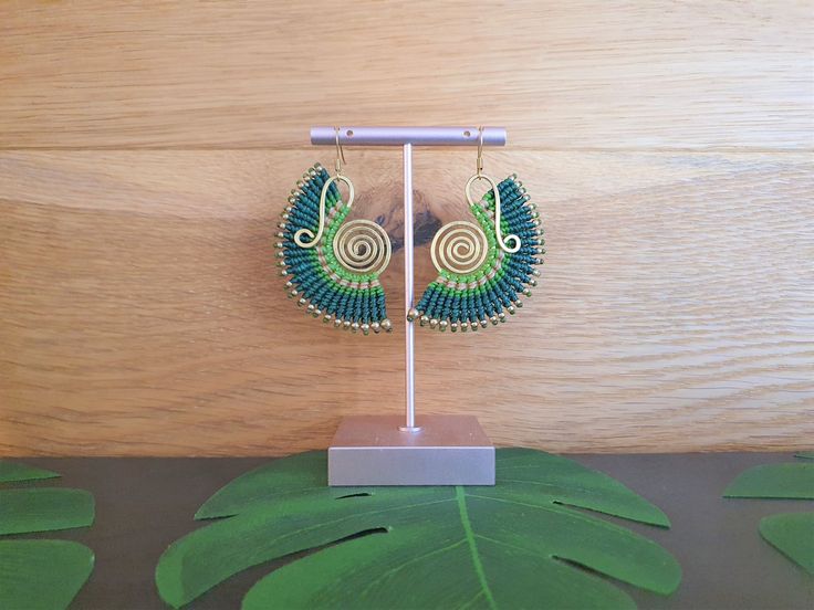 Strikingly bold green macramé earrings, skillfully handwoven round bright gold brass wire, guaranteed to awaken the nature-loving bohemian queen within! For pierced ears, these boho earrings have been lovingly handmade from nickel-free brass wire and waxed cotton which is strong and water-proof. Please do swipe through all the product pictures to get a comprehensive view of the colour and hang of the earrings. Please read the below, in full, prior to purchase. DISPATCH >> Dispatch times ar Green Macrame Jewelry For Festivals, Green Macrame Jewelry For Festival, Green Macrame Dangle Earrings, Green Bohemian Macrame Earrings, Bohemian Green Macrame Earrings, Adjustable Green Bohemian Wrap Earrings, Handmade Adjustable Green Wrap Earrings, Green Macrame Earrings As A Gift, Green Macrame Earrings For Gift