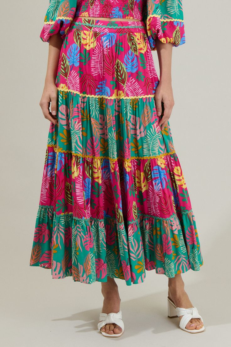 Ready for your next summer vacay? You will need the Marina Tropical Tiered Maxi Skirt! It has colorful tiered layers of this stunning floral print. It has a high waist style and invisible zipper on the side. Add on the matching cropped top to complete the look! - Tiered- Lined- Zipper- Maxi- Color: Fuchsia MultiSize + Fit - Model is 5'8" and wearing size XS- Measurements taken from size S - Waist: 13 1/4"- Length: 37" Fabric Self: 100% Viscose, Contrast: 100% Viscose, Lining: 97% Polyester 3% Sp Ruffle Maxi Skirt, Flowy Maxi Skirts, Tiered Midi Skirt, Column Skirt, Tiered Skirts, Tiered Maxi Skirt, Style Finder, Satin Maxi, Satin Maxi Dress