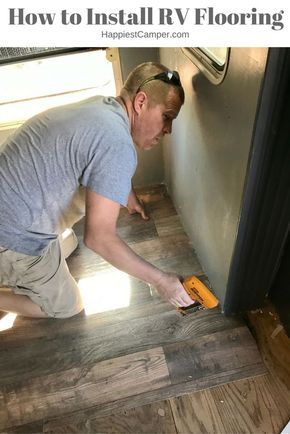 a man is using a drill to install wood flooring