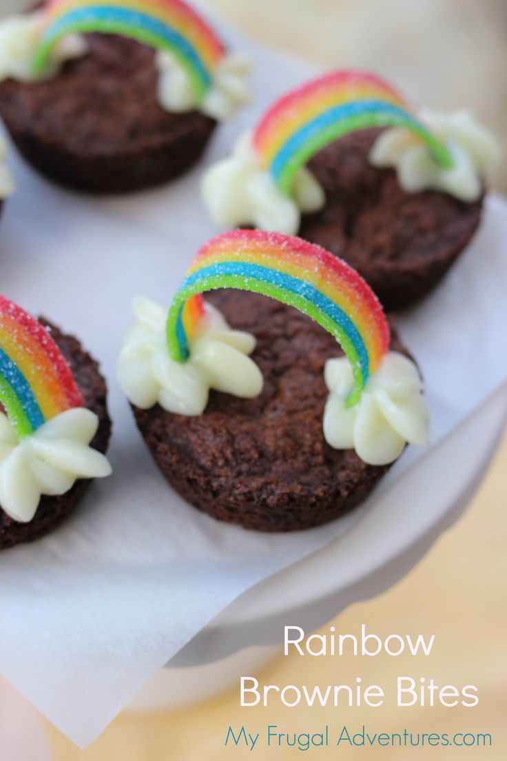 chocolate cupcakes with rainbow frosting on top