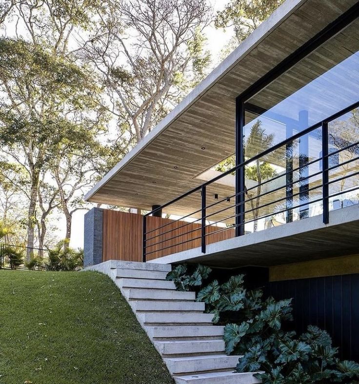 the stairs lead up to the upper level of this modern home