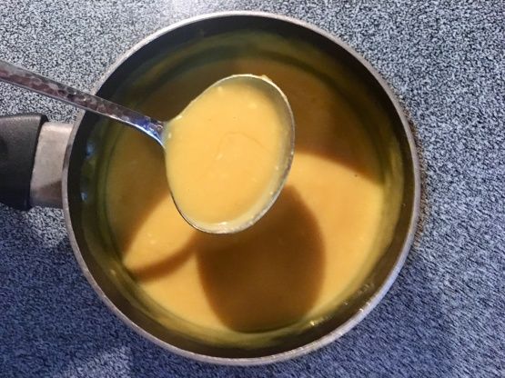 a spoon in a bowl filled with liquid