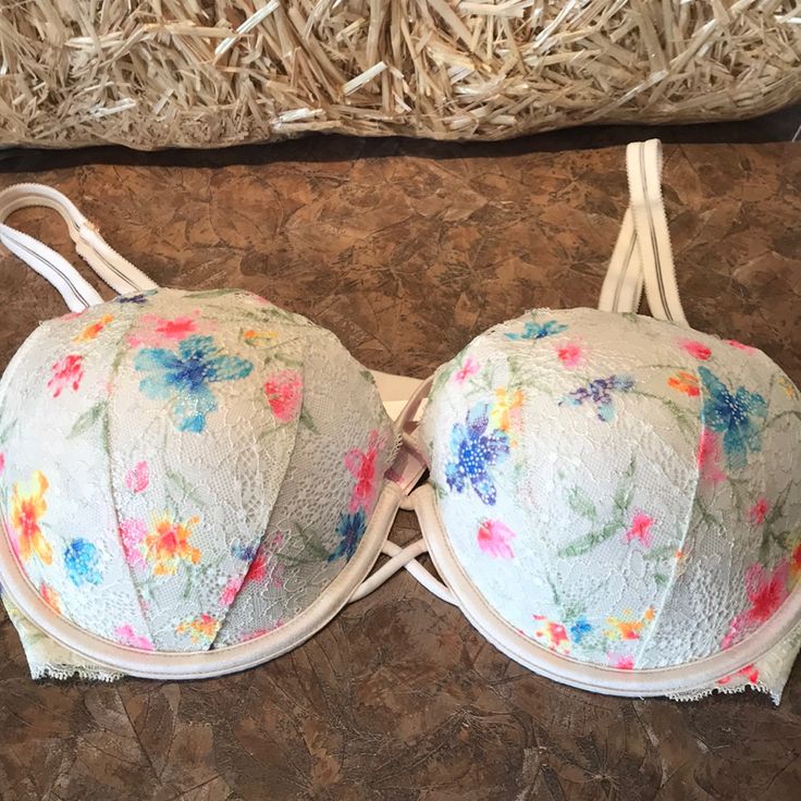 Pink Victoria’s Secret Date Push Up Bra. This Sexy Bra Has Lace And Flower Designs On The Cups With A Cute Crisscross Design In The Front. Inside Pink Colored Cups With Adjustable Straps And Back. New Without Tags Size 36dd. Adorable Spring Floral Print Multicolor Bra, Feminine Spring Bra With Floral Print, Spring Feminine Bra With Floral Print, Feminine Floral Print Bra For Spring, Feminine Spring Floral Print Bra, Spring Feminine Floral Print Bra, Spring Push-up Bra With Padded Cups, Spring Beach Push-up Bra, Spring Push-up Bra