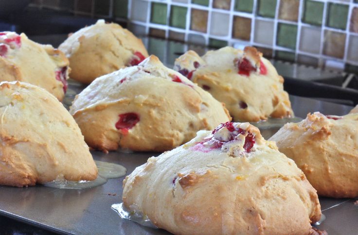 freshly baked muffins sitting on top of a metal tray