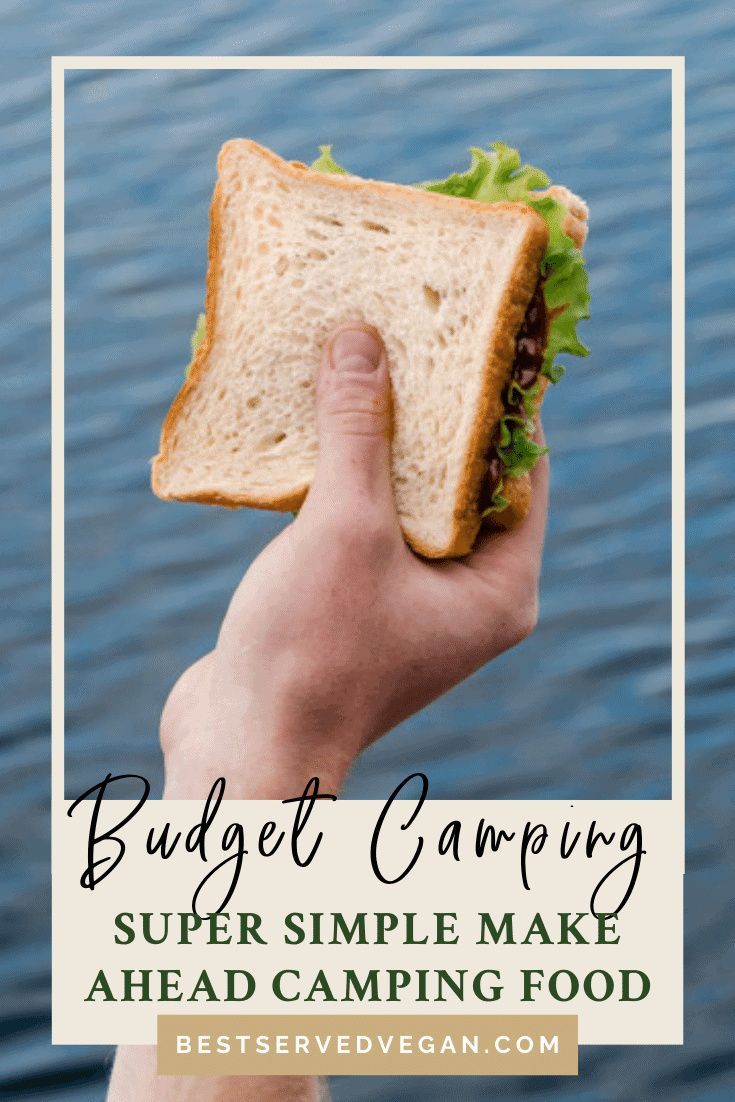 a hand holding a sandwich over water with the words budget camping super simple make ahead camping food