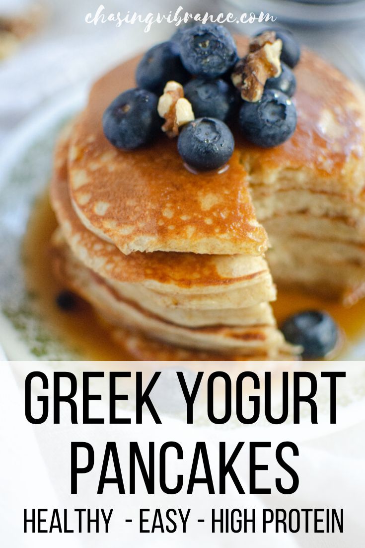 greek yogurt pancakes on a plate with blueberries and syrup in the background