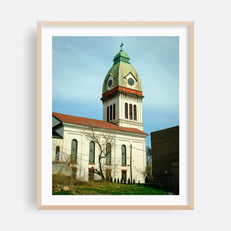 an old building with a steeple and clock on it