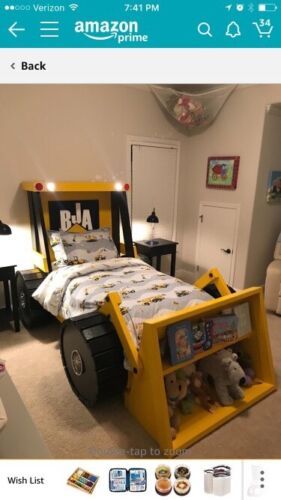 an image of a bedroom with a bed made out of legos and bookshelves