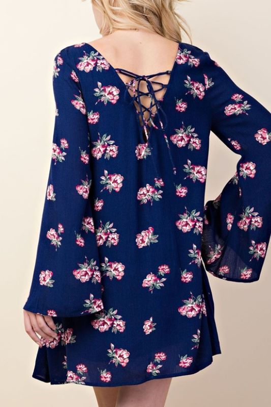 L Love Babydoll comfy soft shift dress with flare bell sleeves, front open pockets and lined. Back lace up adjustable. Mauve fuchsia watercolor inspired floral print. Wide neck.Color: Navy Sizes: S-M-LRuns small Bust 34-36-38, Length 33-34 100% Rayon, Lining 100% Polyester, hand wash cold, imported U4/LV10540 Fall Floral Print Dress With Bell Sleeves, Long Sleeve Dresses With Lace-up Back For Spring, Spring Printed Bell Sleeve Dresses, Spring Floral Print Bell Sleeve Dresses, Spring Bell Sleeve Floral Print Dress, Spring Floral Print Dress With Bell Sleeves, Flowy Floral Print Bell Sleeve Dress, Flowy Floral Print Dress With Bell Sleeves, Bohemian Bell Sleeve Dresses With Floral Print