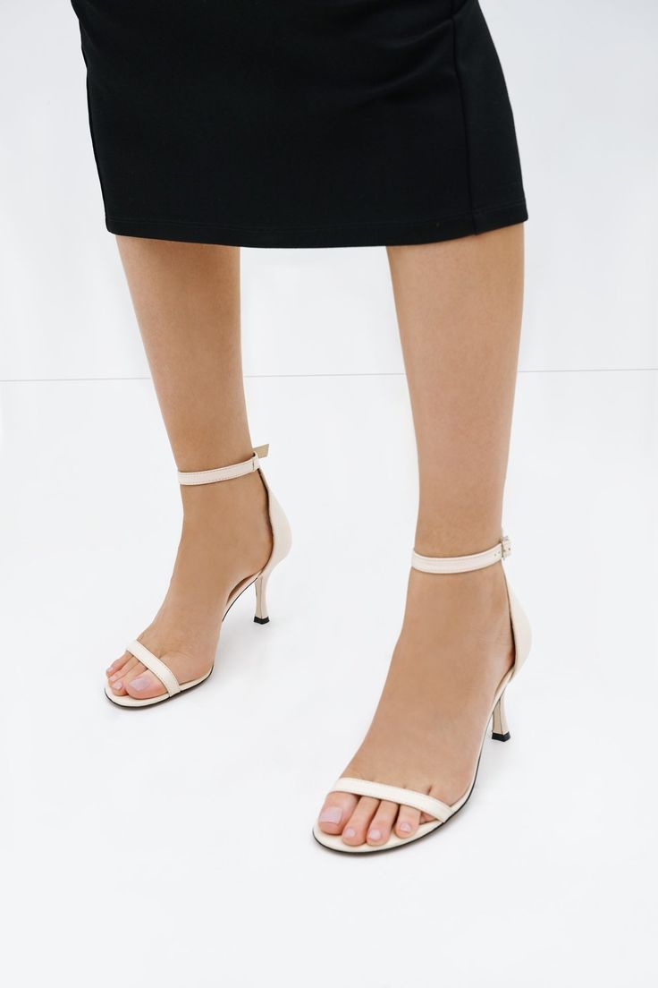 Our Petra Sandals are the perfect example of when less is more. In Italian leather, these round-toe cocktail sandals feature a slender toe strap and an adjustable buckled ankle strap for a clean, minimalist aesthetic. The skinny spool heel gives an elegant lift—and we've added extra padding so they're comfortable for all day wear, too.[SPLIT] Maritza wears Petra in black, in cream, in disco, in spring green, and in hot pink. Heel height is approximately 3" (8 cm). Sold in US sizes, though please Spring Sandals, Spool Heel, The A Team, Summer Clothing, Winter Clothing, Spring Green, Minimalist Aesthetic, Strappy Sandals, Italian Leather