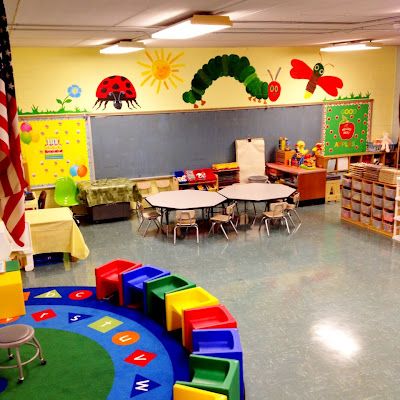 the classroom is decorated in bright colors and has lots of toys for children to play with