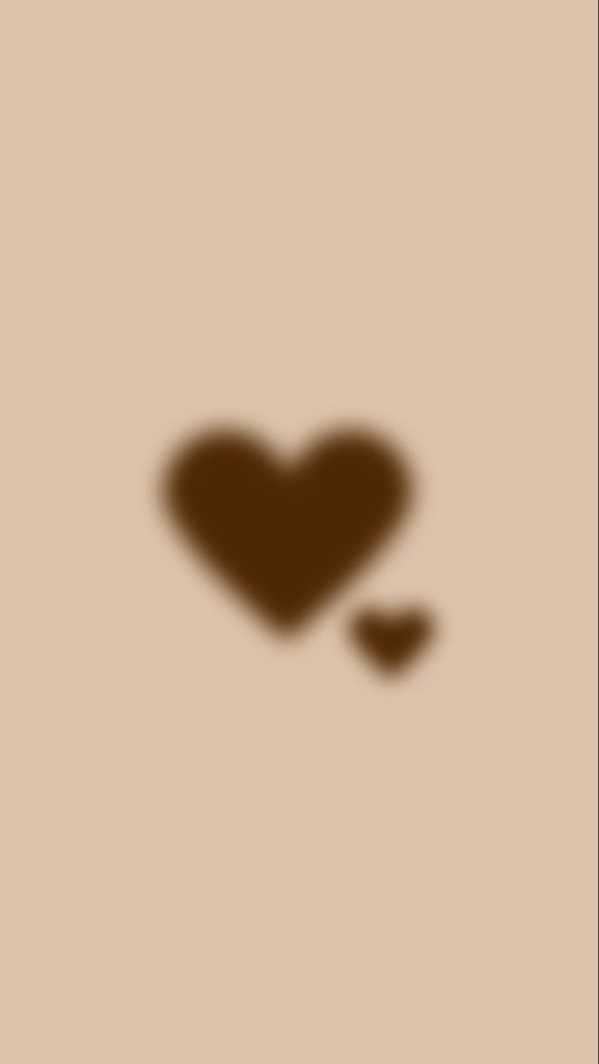 the shadow of a heart is shown on a brown background with two small hearts in it