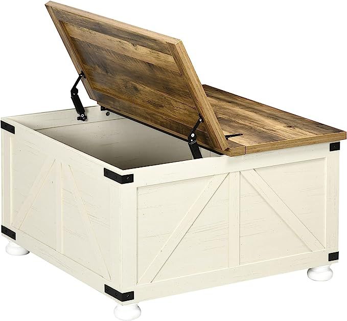 a white storage box with a wooden lid and wheels on the bottom is open to reveal a large piece of furniture