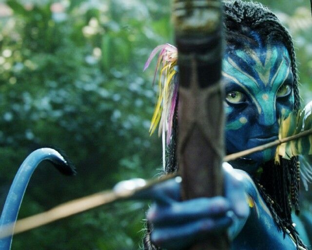 a woman with blue makeup holding a bow and arrow