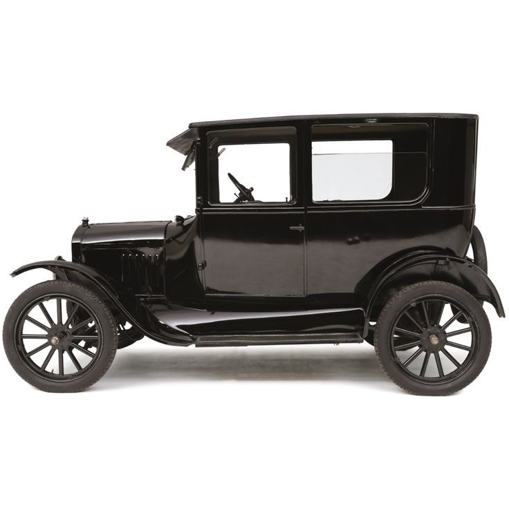 an old model black car on a white background