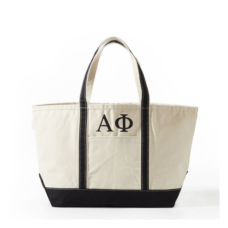 A quality take on a classic, this canvas bag makes an extra cool statement with your house's letters embroidered on the front. Use as an everyday carry-all to get to and from class or as an easy travel tote. Makes a thoughtful gift that any sorority sister will treasure for years to come.    25"w x 9"d x 14"h  Canvas.  Spot clean only.  Imported.  Letters are embroidered. Black Canvas Bag With Embroidered Logo, Canvas Tote Shoulder Bag With Embroidered Logo, Everyday Bags With Embroidered Logo And Double Handle, Canvas Shoulder Bag With Embroidered Logo And Double Handle, Canvas Bags With Embroidered Logo And Double Handle, Classic Bags With Embroidered Logo For Daily Use, Classic Rectangular Bags With Embroidered Logo, Rectangular Canvas Bag With Embroidered Logo, Rectangular Shoulder Bag With Embroidered Logo For Everyday