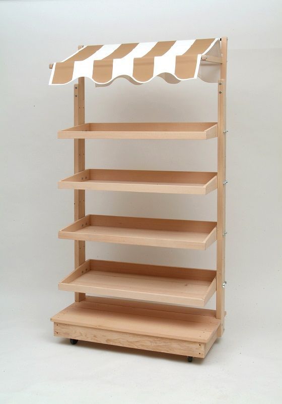 a wooden shelf with three shelves and an awning