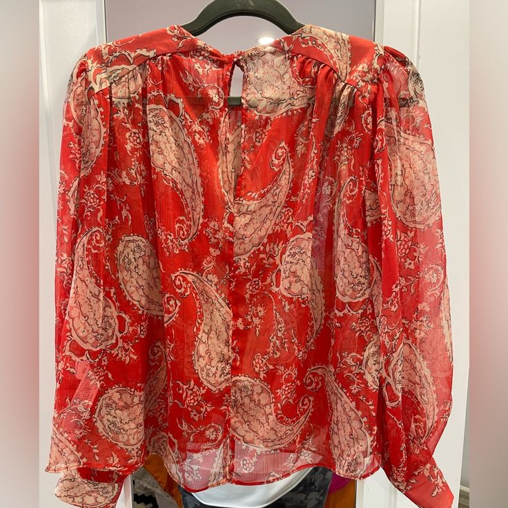 Zara Size L Long Sleeve Pullover Too Made Of 100% Polyester. Red With Cream Paisley Prints Never Worn. Single Fabric Button On Back. Red Bohemian Tops With Paisley Print, Red Bohemian Blouse With Paisley Print, Red Bohemian Paisley Print Tops, Summer Red Blouse With Paisley Print, Red V-neck Blouse With Paisley Print, Red Long Sleeve Blouse With Paisley Print, Casual Red Tops With Paisley Print, Casual Red Paisley Print Top, Zara Tops