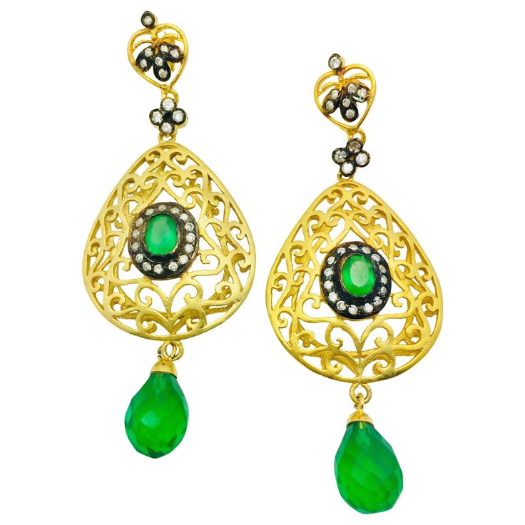 The handmade filigree faux emerald green earrings is ornate and lovely, it is further enhanced by sparkling CZ stones. Earrings have a post closure for pierced ears. Length: 2 3/4 inches Width: 1 1/2 inches Elegant Green Chandelier Earrings With Intricate Design, Luxury Green Teardrop Earrings, Green Pierced Chandelier Earrings For Party, Exquisite Party Earrings With Intricate Design, Green Chandelier Pierced Earrings For Party, Green Jeweled Earrings For Formal Occasions, Elegant Green Earrings With Intricate Design, Elegant Green Chandelier Earrings For Festive Occasions, Green Luxury Pierced Earrings