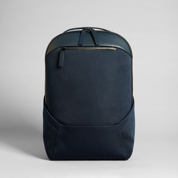 a blue backpack sitting on top of a white table