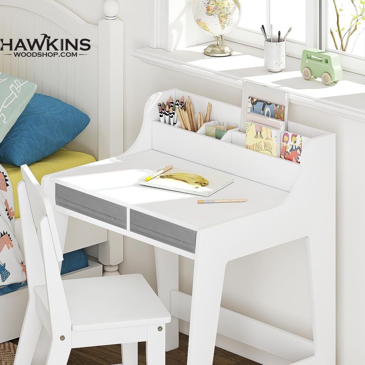 a child's desk and chair in a white room