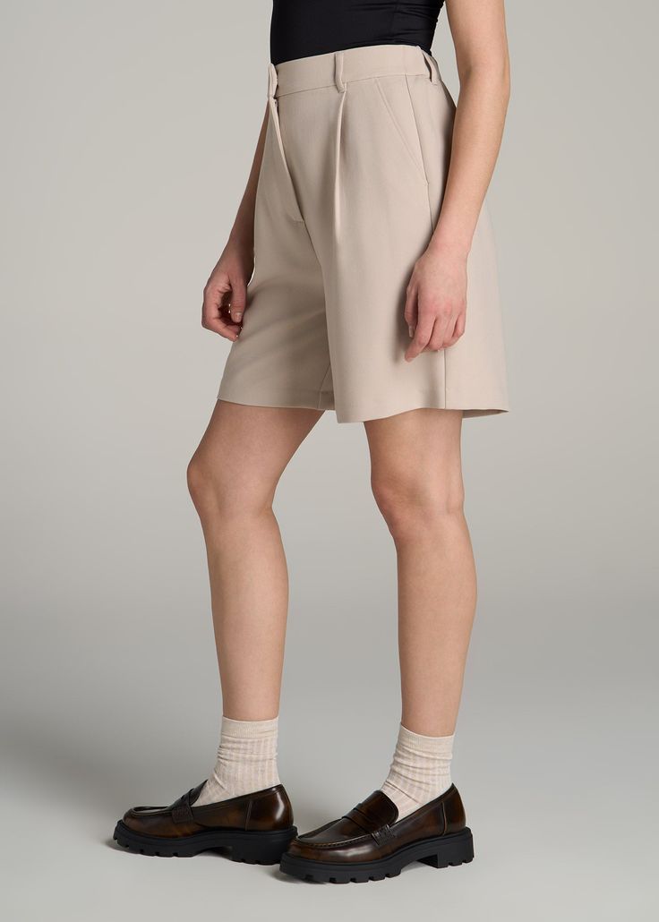 Pleated Tall Women's Shorts: Sophistication Styled for Summer Shorts with No Shortage of Comfort Discover the perfect blend of elegance and comfort with our Pleated Tailored Shorts. Embrace the ultra high-rise fit and sophisticated pleating that effortlessly transitions from a casual brunch to an evening out. Crafted with a premium blend of breathable and stretchable materials, these tall women's shorts redefine summer sophistication, ensuring you never have to compromise on fit or style again.• Chic Bottoms With Built-in Shorts And Relaxed Fit, Elegant Fitted Shorts For Loungewear, Elegant Beige Stretch Bottoms, Elegant Stretch Beige Bottoms, Elegant Stretch Beige Shorts, Elegant Stretch Pants With Short Length, Elegant Bermuda Shorts For Workwear, Elegant Stretch Bottoms With Short Leg, Elegant Solid Color Shorts For Work