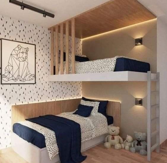 two bunk beds in a bedroom with blue and white bedding