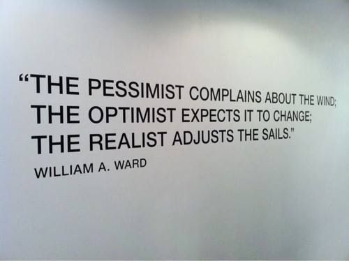 a wall with a quote on it that says the pessist complaints about the wind, the optimist expect it to change